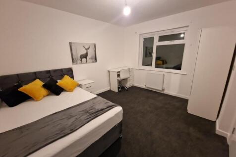 Bright, freshly redecorated bedroom with a comf...