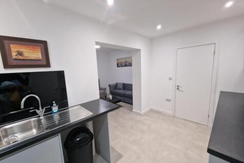 Bright modern kitchen with a stainless-steel si...