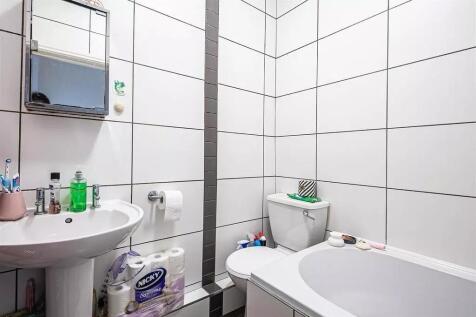 A clean and modern bathroom suite featuring a w...