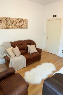 Bright, welcoming living room with comfortable ...