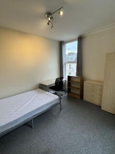 Bright, tidy single bedroom with a large window...