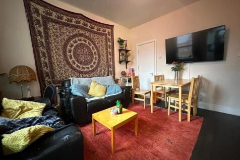 Warm, relaxed living room with comfortable leat...