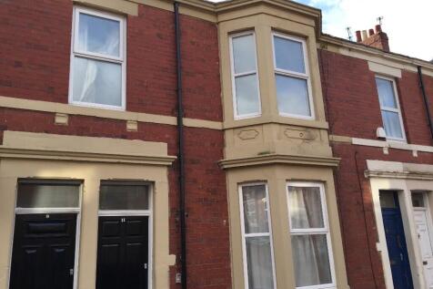 Brick terraced house with bay window and painte...