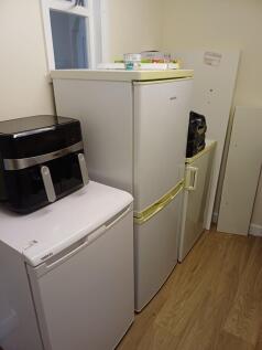 Compact utility corner with two under-counter f...