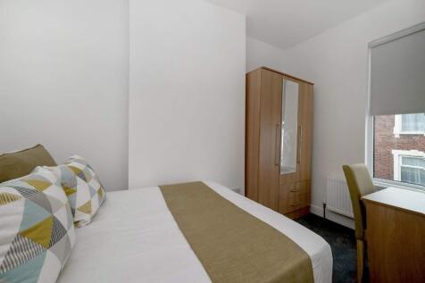 Bright, neatly presented bedroom with a double ...