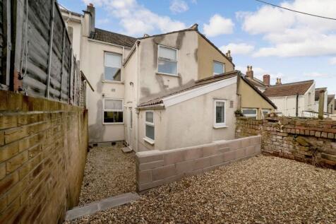 Gravelled rear outdoor area with walled boundar...