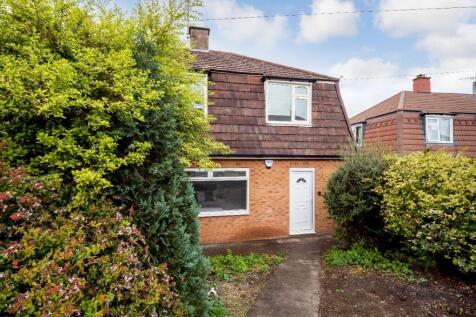 Traditional semi-detached home with a paved pat...