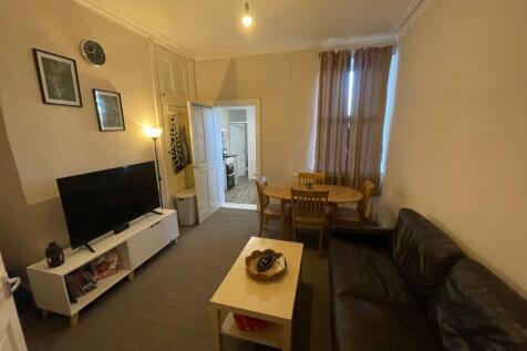 Comfortable shared living room with a large sea...