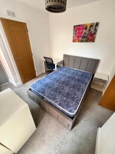 Bright, modern bedroom with a comfortable doubl...