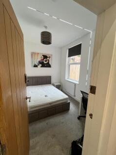 Bright, freshly decorated double bedroom with a...
