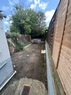 A private outdoor garden space featuring a pave...