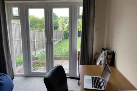 Bright rear-facing room with full-height patio ...