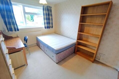 Bright single bedroom with a large window, neat...