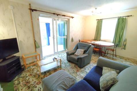 Bright, comfortable living room with sliding do...