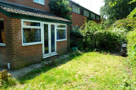 Sunny private rear garden with lawn, mature hed...