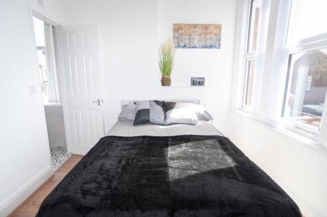 Bright, neatly presented bedroom with a double ...