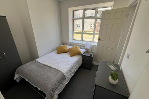 Bright, well-presented bedroom with a large fro...