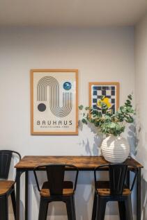 Stylish study nook with a warm wooden high tabl...