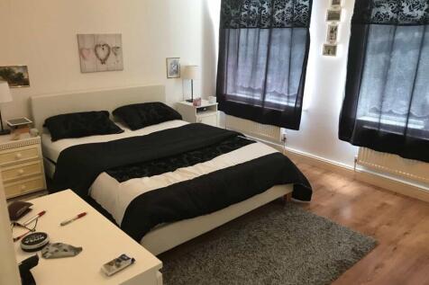 A stylish double bedroom featuring a comfortabl...