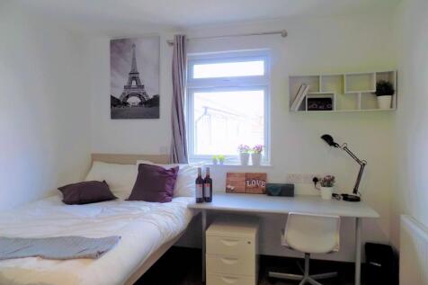 Bright, tidy bedroom with a comfortable bed, bu...