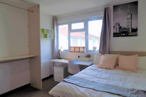 Bright, neatly presented bedroom with a double ...