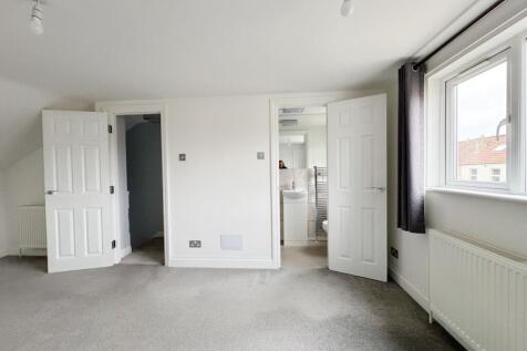 Bright, recently redecorated master bedroom wit...