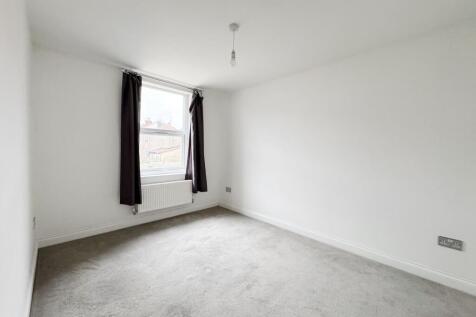 Bright, recently redecorated bedroom with neutr...