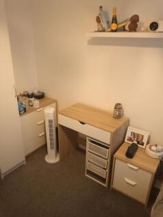 Neat furnished bedroom corner with coordinated ...