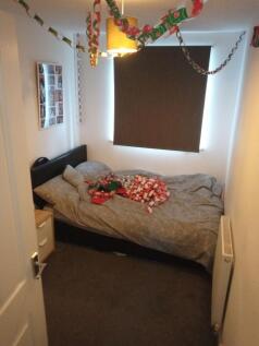 Neatly presented bedroom with a comfortable dou...