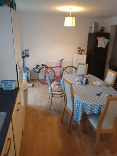 Bright open kitchen-diner with a polka-dot cove...