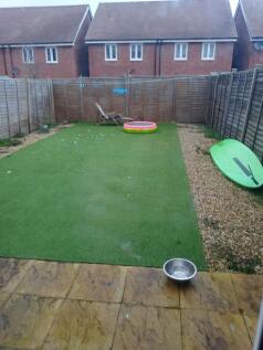 Private rear garden with low-maintenance artifi...