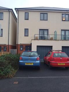 Modern townhouse with driveway parking for two ...