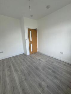 Bright, freshly painted single bedroom with mod...