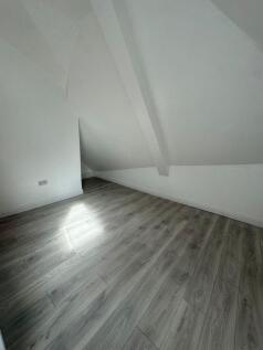 Bright, newly finished attic bedroom with fresh...