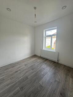 Bright, freshly painted single bedroom with mod...