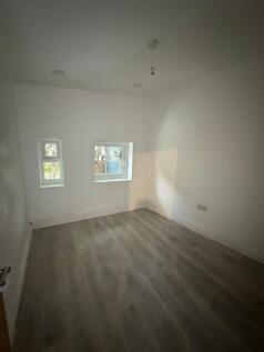 Freshly painted compact bedroom with modern woo...