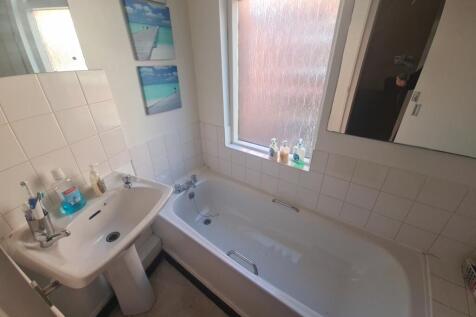 A clean and well-maintained bathroom featuring ...