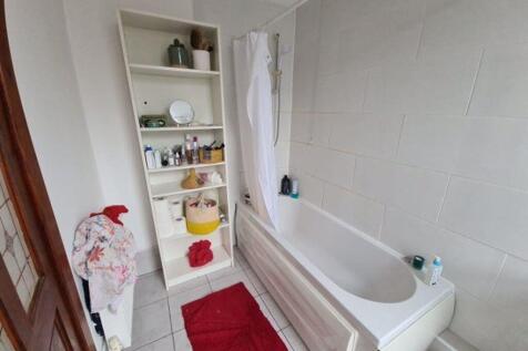 A clean and modern bathroom featuring a spaciou...