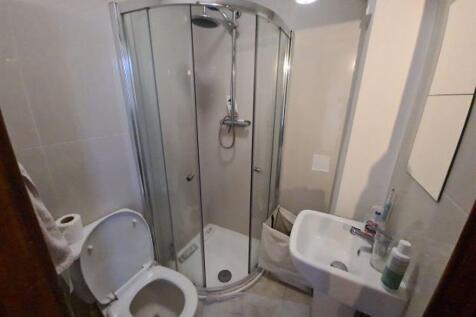 A modern, well-maintained bathroom with a showe...