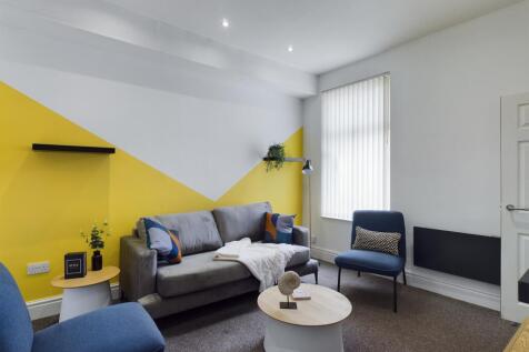 A stylish and spacious modern living room, perf...