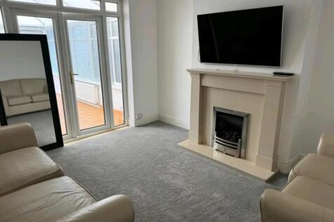 A bright and cozy living room featuring a styli...