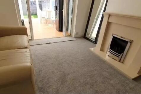 This inviting living room features a cozy seati...