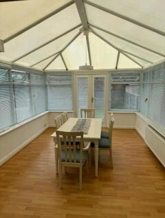 Bright and inviting communal lounge with ample ...