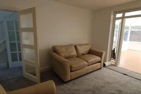 Bright and inviting living room featuring comfo...