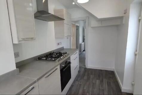 Modern kitchen featuring sleek cabinetry and am...