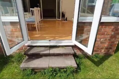 Charming entrance showcasing a well-maintained ...