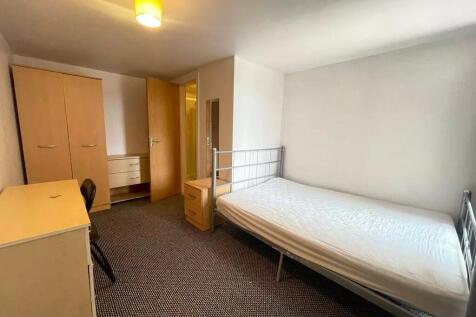 Bright and spacious double bedroom featuring a ...