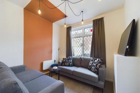 A bright and inviting living room featuring sty...