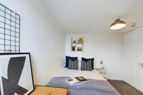 A stylish and inviting double bedroom featuring...