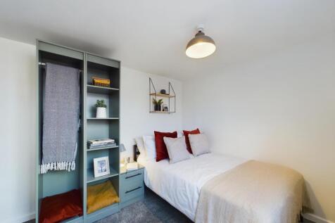 A bright and inviting double bedroom featuring ...